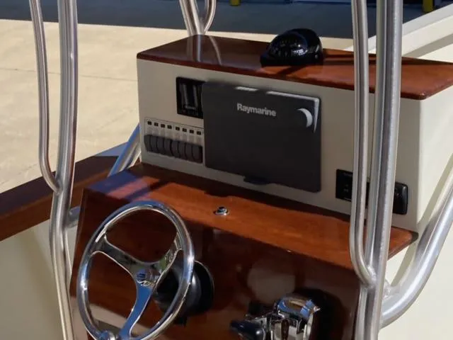 Slide: The Image of 2014 Custom 24' Center Console boat dashboard with Raymarine navigation system. - 5