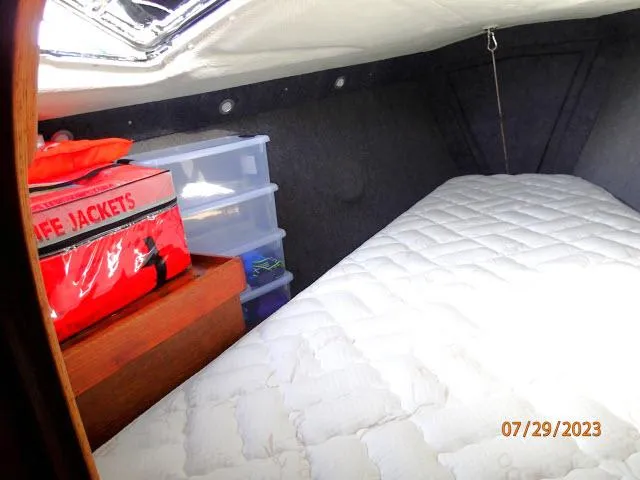 Slide: The Image of Interior cabin of 1976 Choate Custom 38 with life jackets and storage. - 24