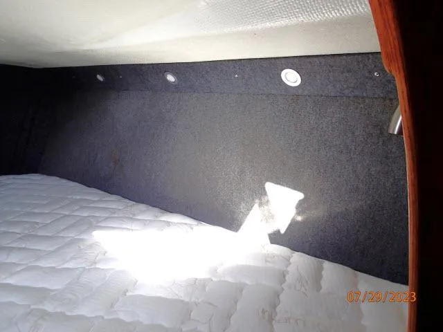 Slide: The Image of Interior cabin of 1976 Choate Custom 38 sailboat with bed and lighting. - 25