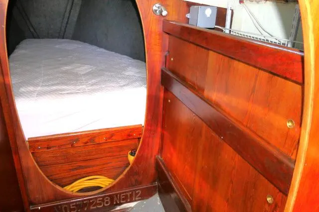Slide: The Image of 1976 Choate Custom 38 interior with wooden paneling and cozy sleeping area. - 27