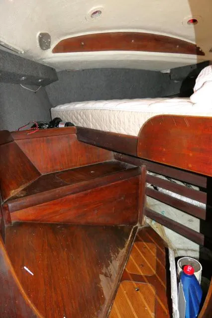 Slide: The Image of Interior cabin of 1976 Choate Custom 38 sailboat with wooden furnishings. - 29