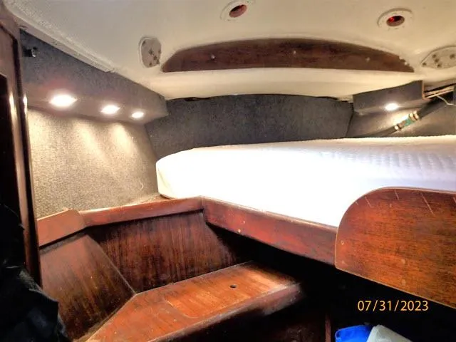 Slide: The Image of Cozy cabin interior of 1976 Choate Custom 38 sailboat with wooden furnishings. - 30