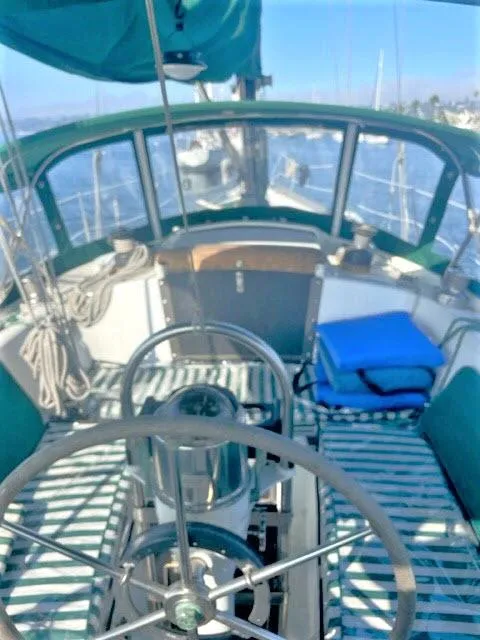 Slide: The Image of 1976 Choate Custom 38 sailboat cockpit with steering wheel and nautical equipment. - 36