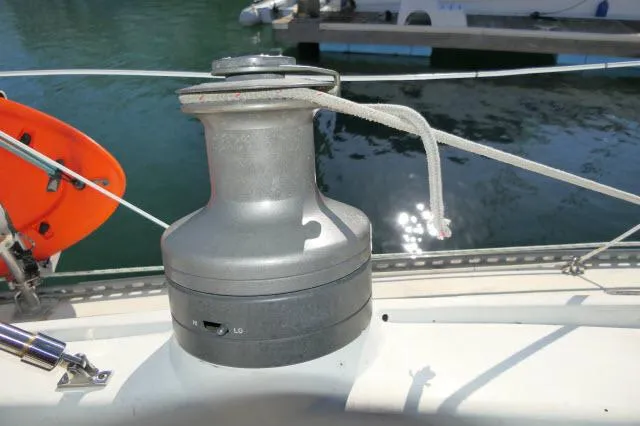 Slide: The Image of Winch on 1976 Choate Custom 38 sailboat deck by the water. - 38