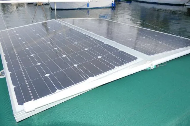Slide: The Image of Solar panels on a 1976 Choate Custom 38 boat, docked on water. - 45