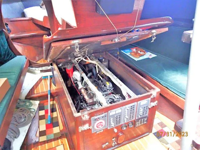 Slide: The Image of Engine compartment of 1976 Choate Custom 38 sailboat with open access panel. - 49