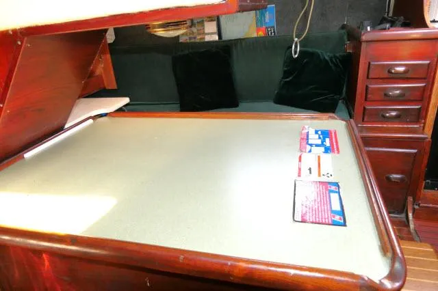 Slide: The Image of Interior of 1976 Choate Custom 38 sailboat with wooden desk and storage drawers. - 8