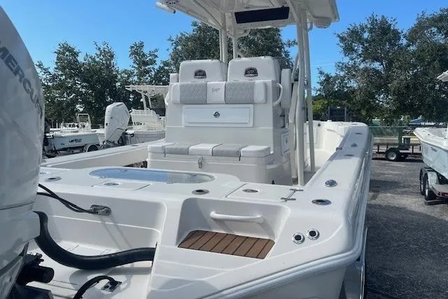 Slide: The Image of 2024 Ranger 2600 Bay boat with sleek design and spacious seating. - 2