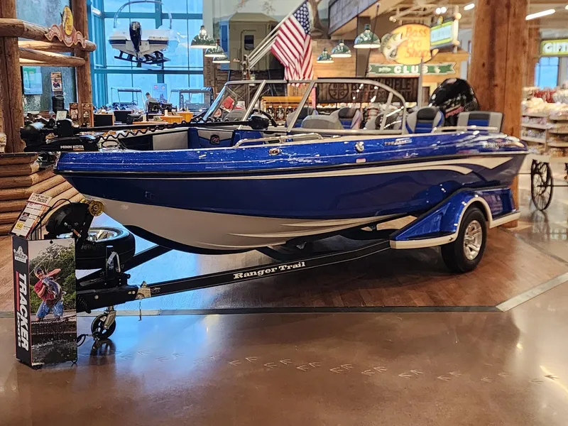 Slide: The Image of 2024 Ranger 1880MS blue boat on display indoors. - 0