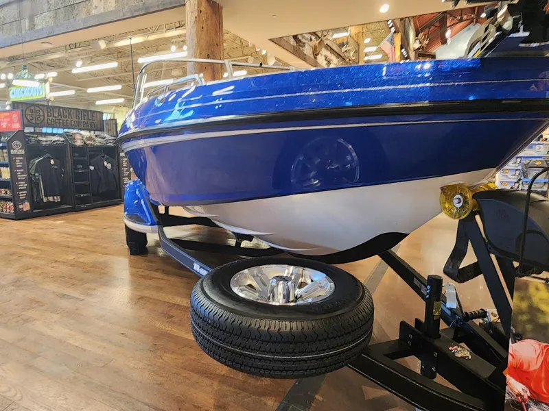 Slide: The Image of 2024 Ranger 1880MS boat on display indoors. - 3