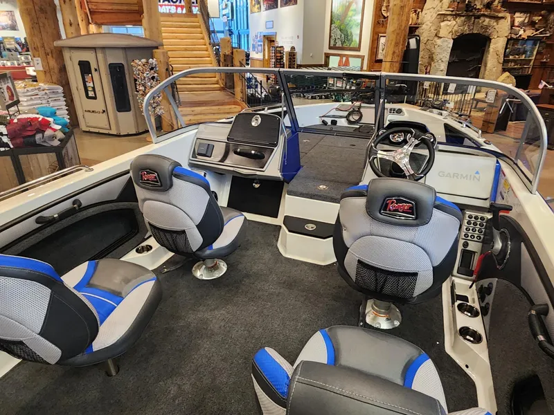 Slide: The Image of 2024 Ranger 1880MS boat interior with modern seating and Garmin navigation system. - 4