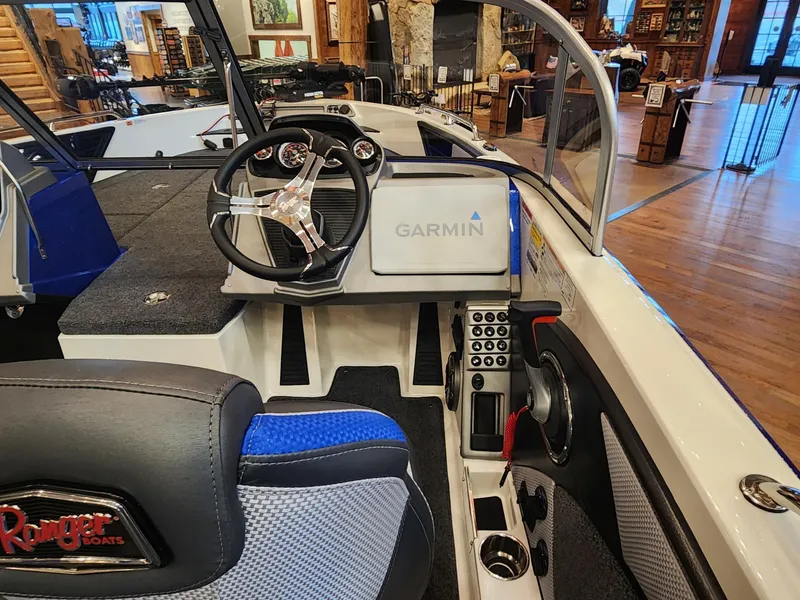 Slide: The Image of 2024 Ranger 1880MS boat interior with Garmin navigation system and steering wheel. - 7