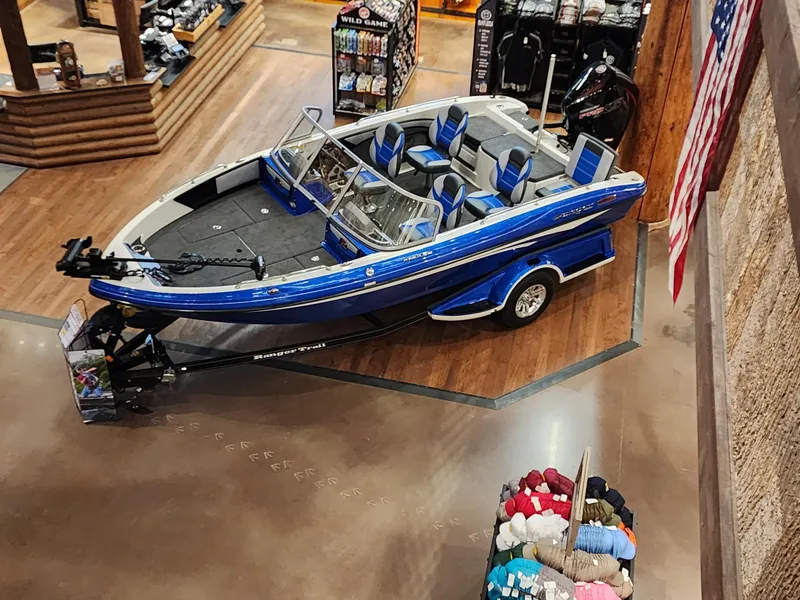 Slide: The Image of 2024 Ranger 1880MS boat on display in a showroom. - 8