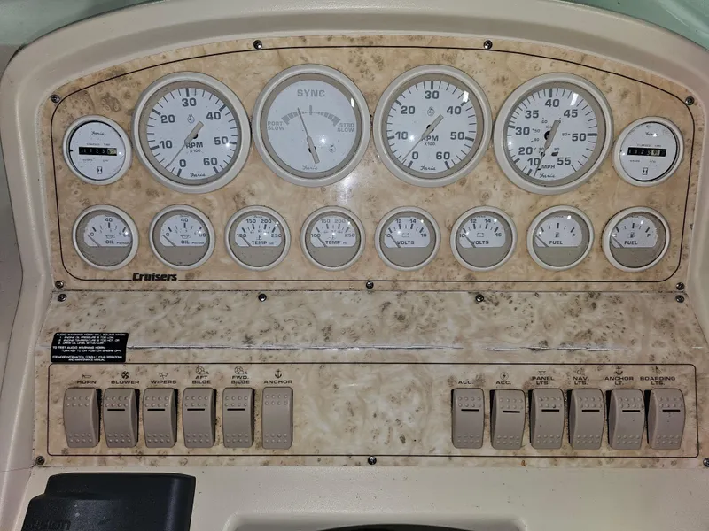 Slide: The Image of Dashboard of a 1997 Cruisers Yachts 3120 Aria with gauges. - 12
