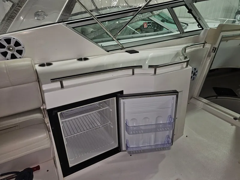 Slide: The Image of Interior of a 1997 Cruisers Yachts 3120 Aria with open refrigerator. - 17