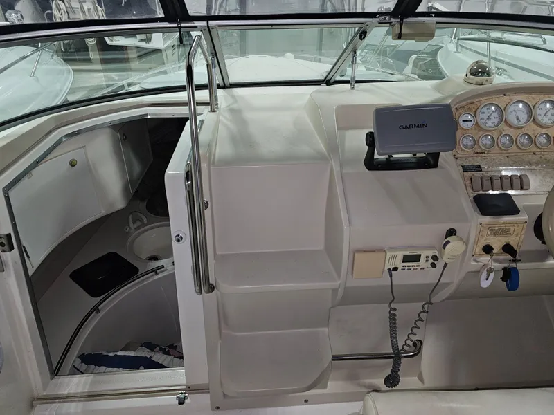 Slide: The Image of Interior of a 1997 Cruisers Yachts 3120 Aria with helm console. - 18
