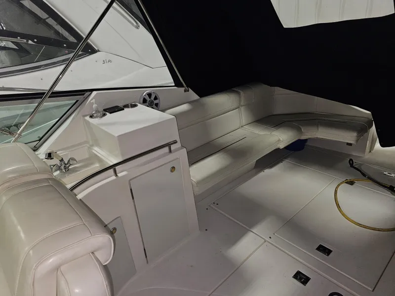 Slide: The Image of Interior of a 1997 Cruisers Yachts 3120 Aria with white leather seating. - 20