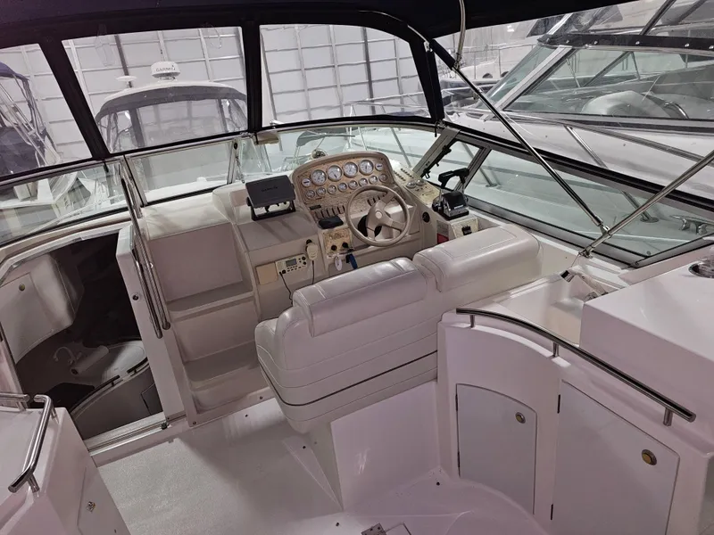 Slide: The Image of Interior of a 1997 Cruisers Yachts 3120 Aria with helm station. - 21