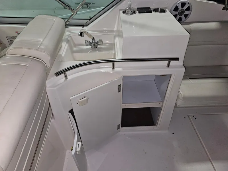 Slide: The Image of Interior of 1997 Cruisers Yachts 3120 Aria with sink and storage. - 22