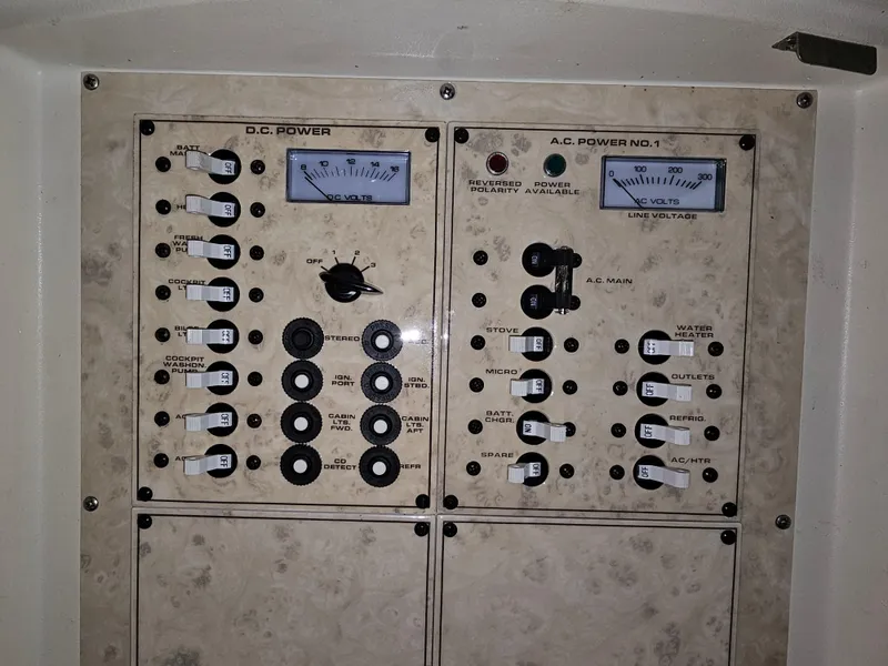 Slide: The Image of 1997 Cruisers Yachts 3120 Aria control panel with power gauges. - 24