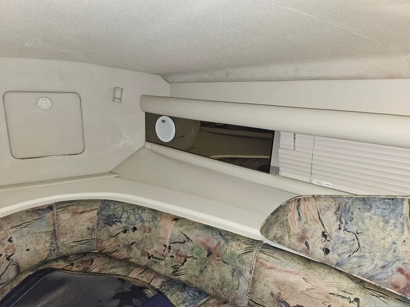 Slide: The Image of Interior of a 1997 Cruisers Yachts 3120 Aria with patterned upholstery. - 27