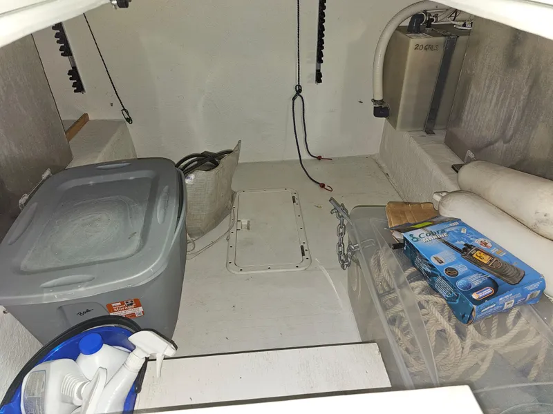 Slide: The Image of Interior of a 1997 Cruisers Yachts 3120 Aria with storage and accessories. - 28