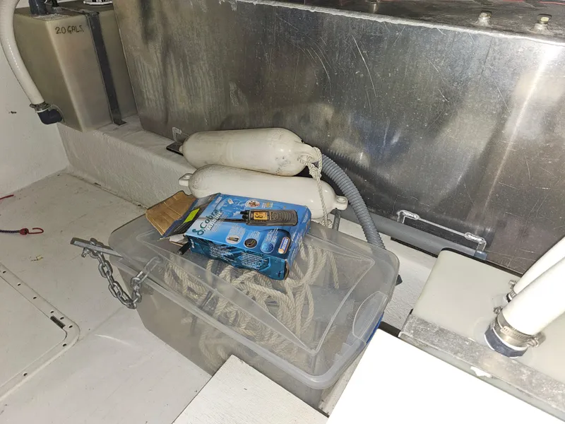 Slide: The Image of Interior of 1997 Cruisers Yachts 3120 Aria with rope and tools. - 29