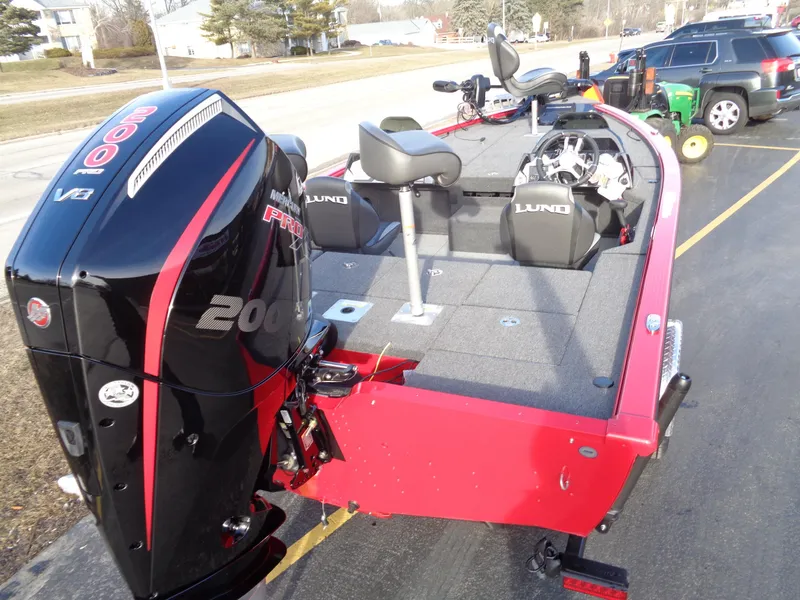 Slide: The Image of 2024 Lund 1875 Pro-V Bass boat with 200 HP Mercury engine. - 12