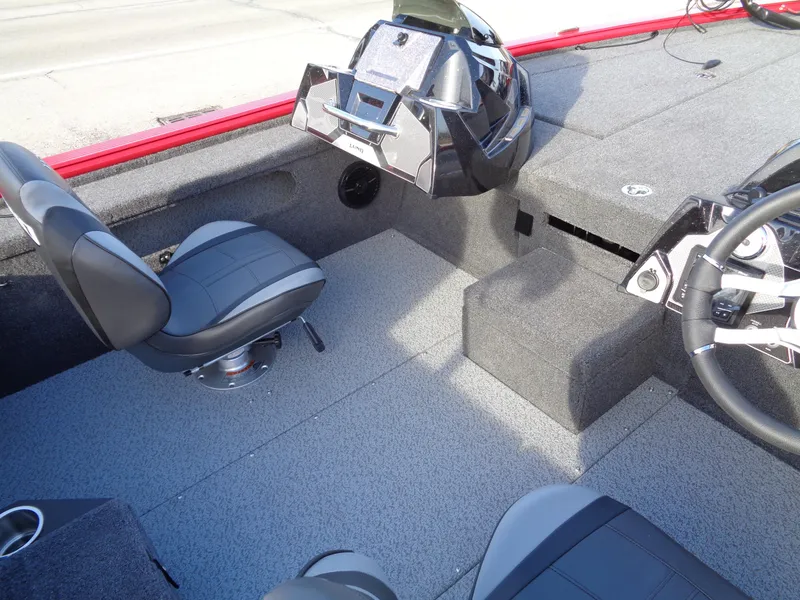 Slide: The Image of 2024 Lund 1875 Pro-V Bass boat interior with seating and console. - 6
