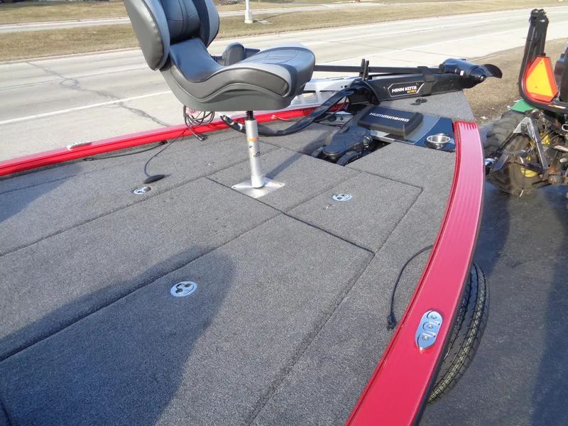 Slide: The Image of 2024 Lund 1875 Pro-V Bass boat with gray deck and red trim. - 9