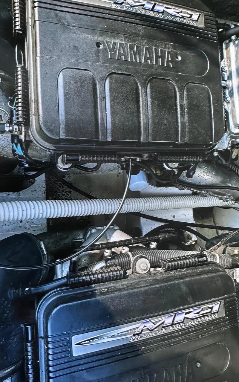 Slide: The Image of Close-up of 2006 Yamaha SX 230 boat engine components. - 13