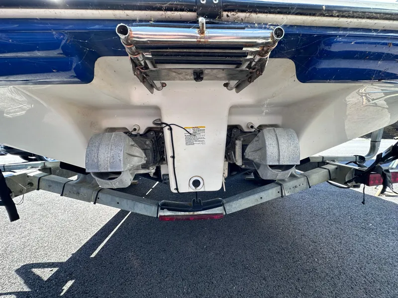 Slide: The Image of 2006 Yamaha Boats SX 230 on trailer, showing dual jet drives and rear hull. - 15