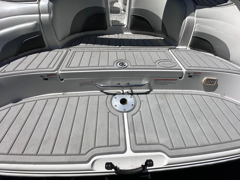 Slide: The Image of 2006 Yamaha Boats SX 230 rear deck with seating and storage compartments. - 17