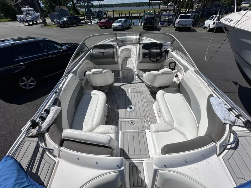 Slide: The Image of 2006 Yamaha Boats SX 230 interior view with seating and steering console. - 18