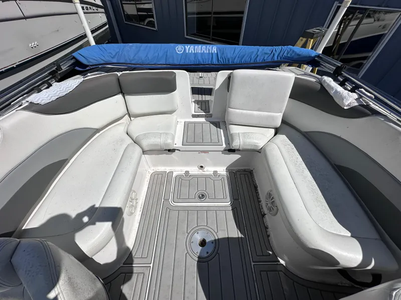 Slide: The Image of 2006 Yamaha Boats SX 230 interior seating area with gray and white upholstery. - 24