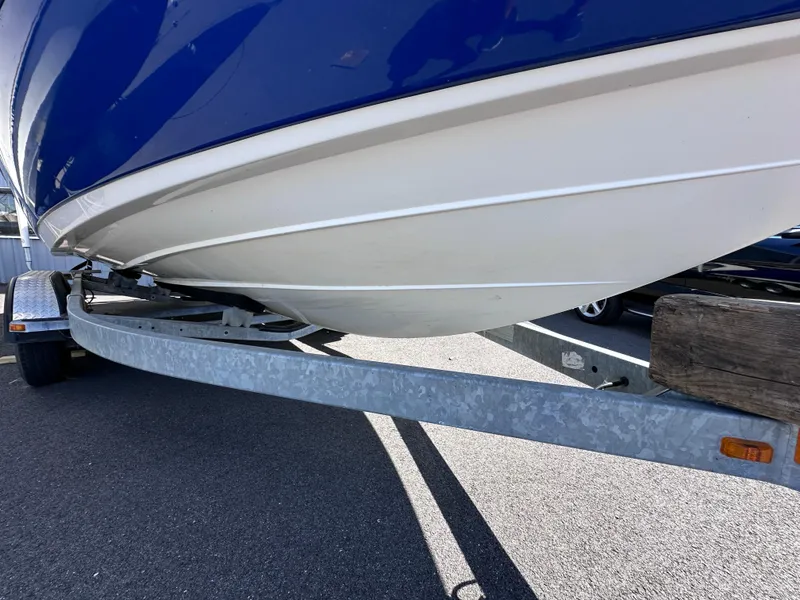 Slide: The Image of Close-up of a 2006 Yamaha Boats SX 230 hull on a trailer. - 6