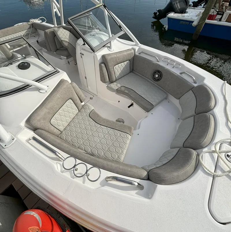 Slide: The Image of 2023 Sea Fox 226 Traveler boat with spacious seating and modern design. - 2