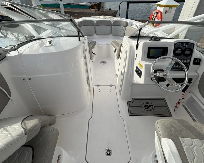 Slide: The Image of 2023 Sea Fox 226 Traveler boat interior with steering console and seating. - 3