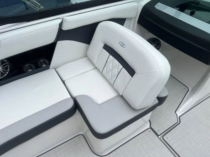Slide: The Image of 2024 Regal 2000 ES boat interior seating with white and gray upholstery. - 11
