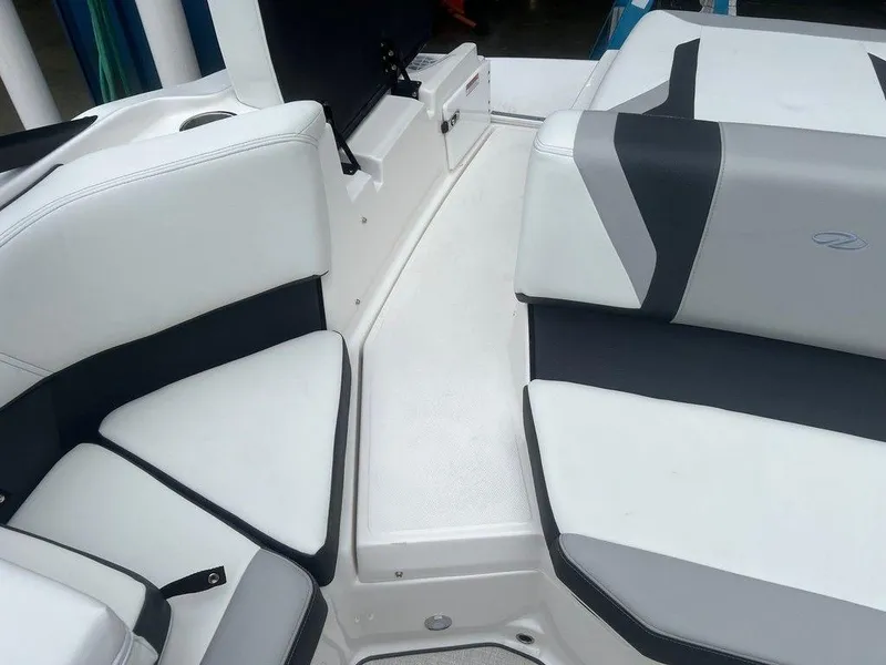 Slide: The Image of 2024 Regal 2000 ES boat interior with white and gray seating. - 12