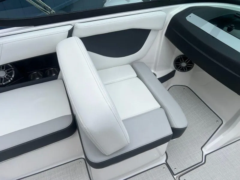 Slide: The Image of 2024 Regal 2000 ES boat interior with white and gray seating. - 13