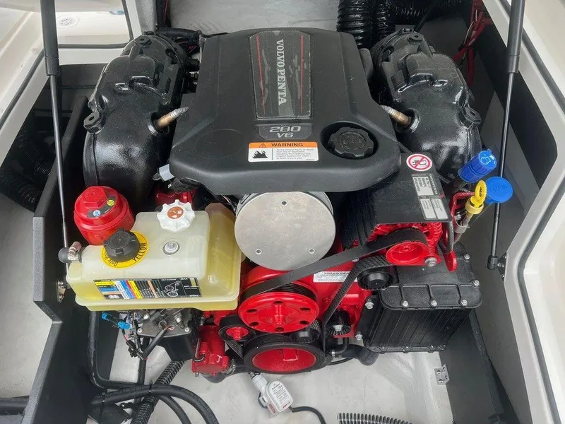 Slide: The Image of 2024 Regal 2000 ES boat engine compartment with Volvo Penta 280 V6 engine. - 15