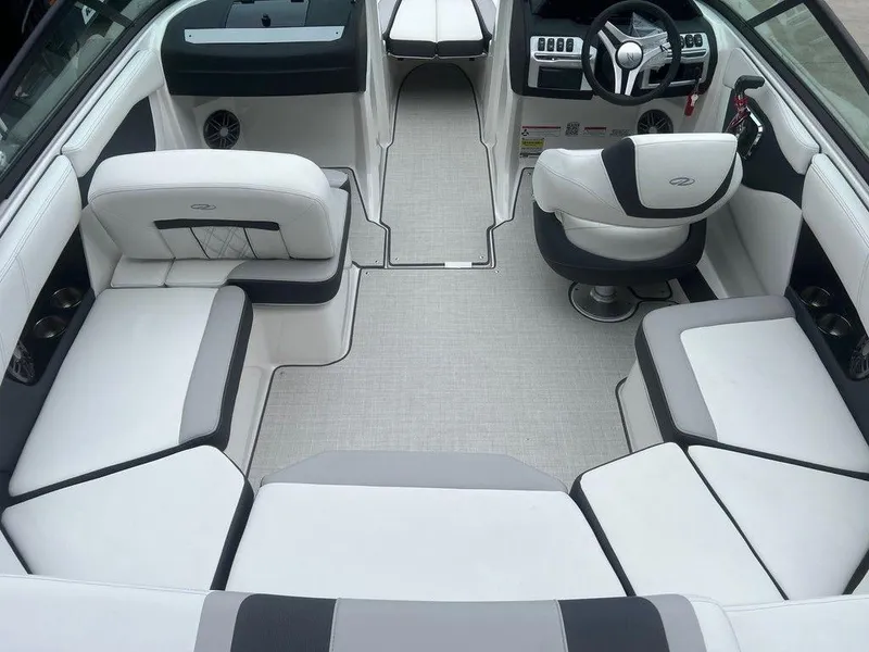Slide: The Image of 2024 Regal 2000 ES boat interior with white and gray seating. - 18