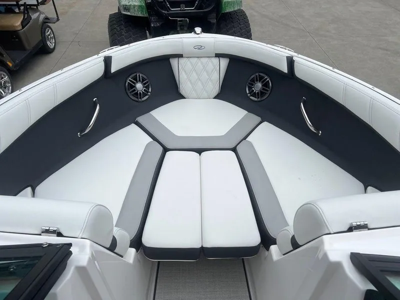 Slide: The Image of 2024 Regal 2000 ES boat interior with white and gray seating. - 3