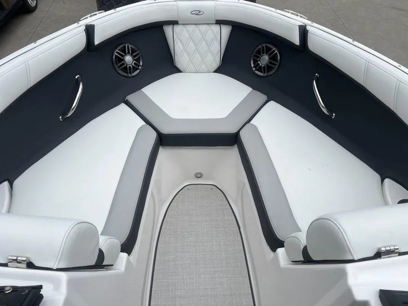 Slide: The Image of 2024 Regal 2000 ES boat interior with white and gray cushioned seating. - 4