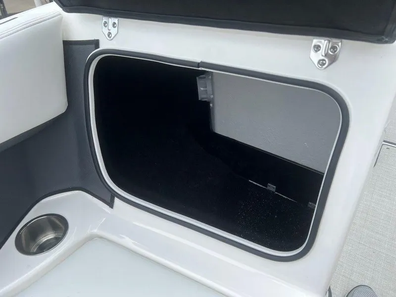 Slide: The Image of Open storage compartment in a 2024 Regal 2000 ES boat. - 6