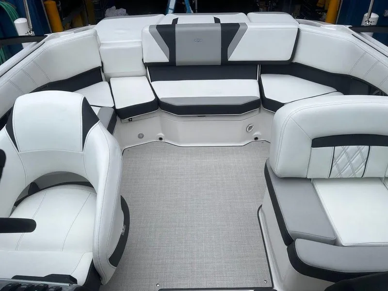 Slide: The Image of 2024 Regal 2000 ES boat interior with white and gray seating. - 8
