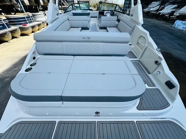 Slide: The Image of 2024 Sea Ray 270 SDX boat with spacious seating and modern design. - 11