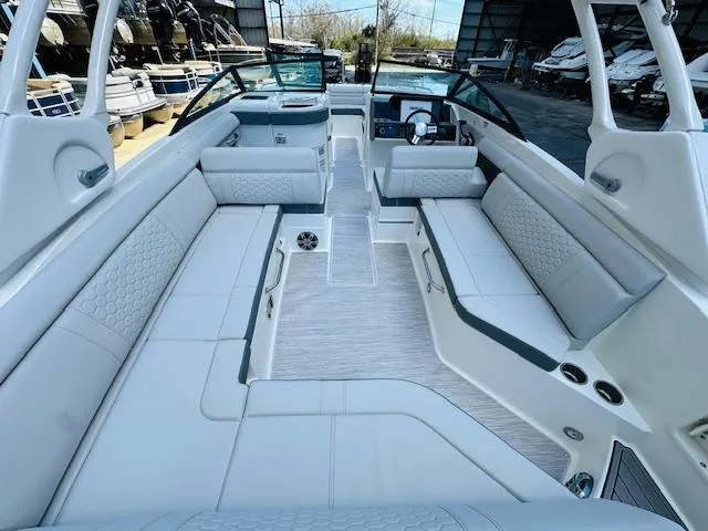 Slide: The Image of 2024 Sea Ray 270 SDX boat interior with spacious seating and modern design. - 12
