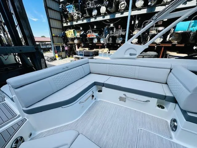 Slide: The Image of 2024 Sea Ray 270 SDX boat interior with spacious seating and modern design. - 15